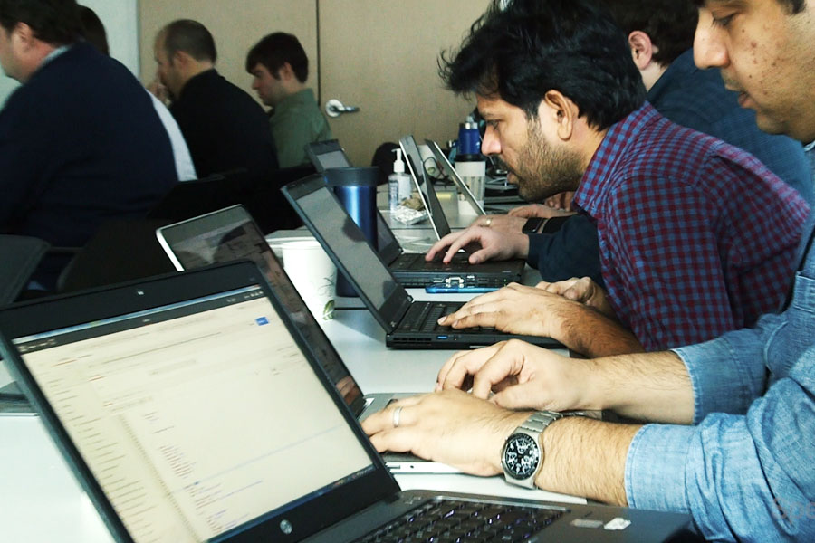 Rows of people using computers