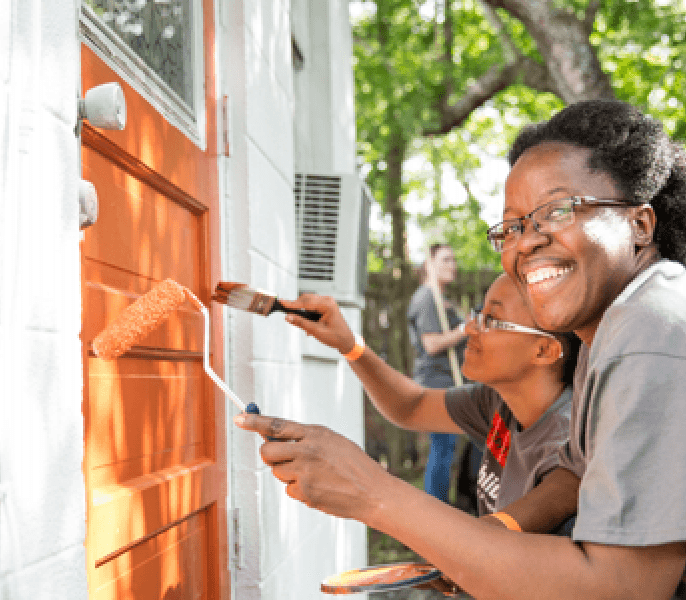 People painting a door